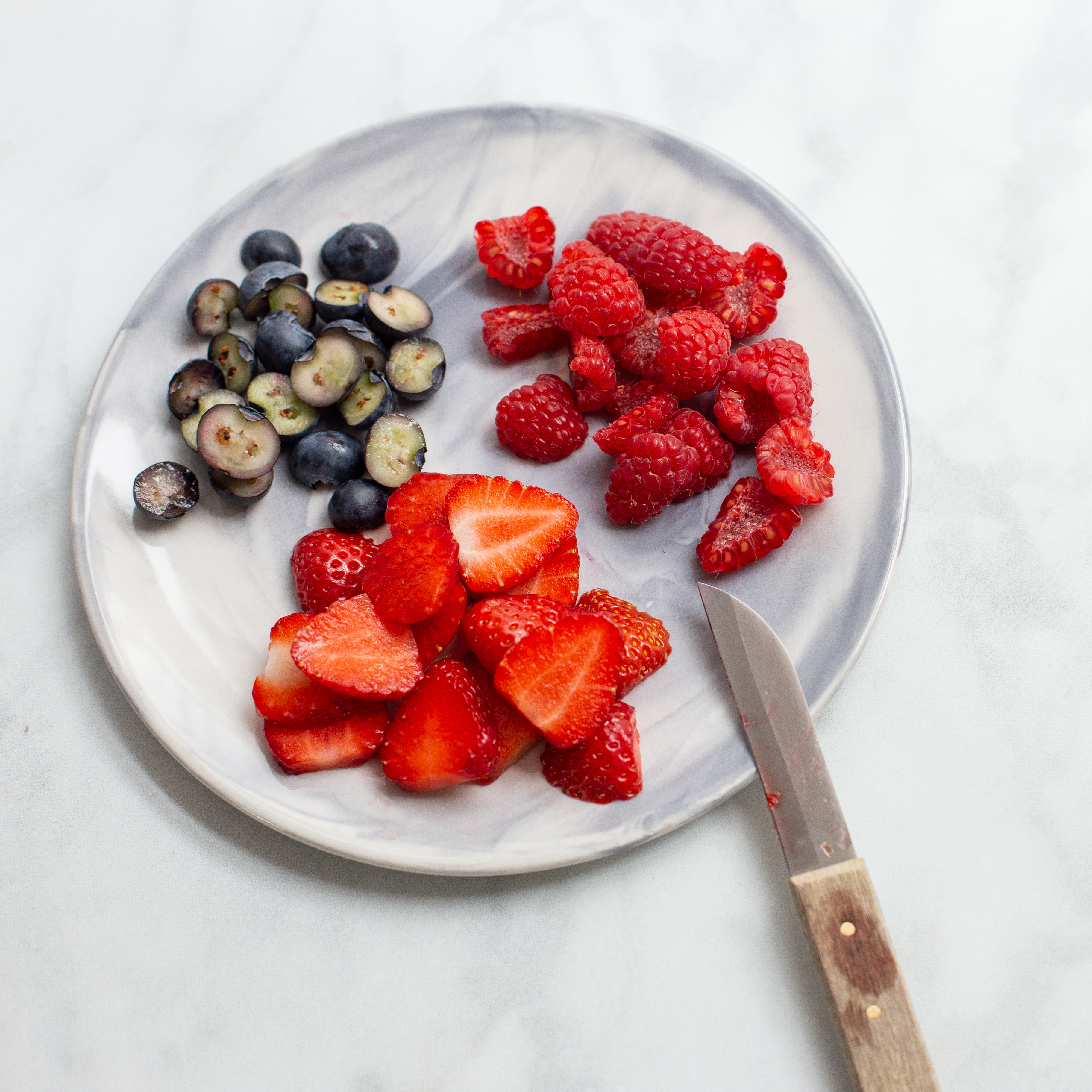 Chop your berries onto a side plate